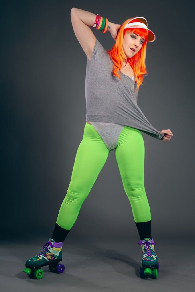 Vibrant retro fashion portrait of a roller skater indoors with neon accents.